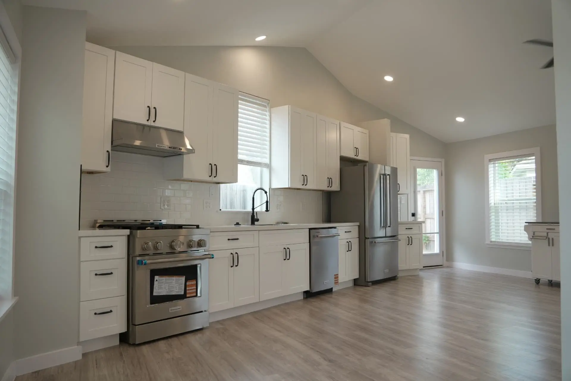 Kitchen wall with gas range and range hood